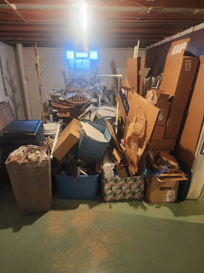 Roll-off dumpster container at job site for 15 Yard Dumpster Rental in Utica